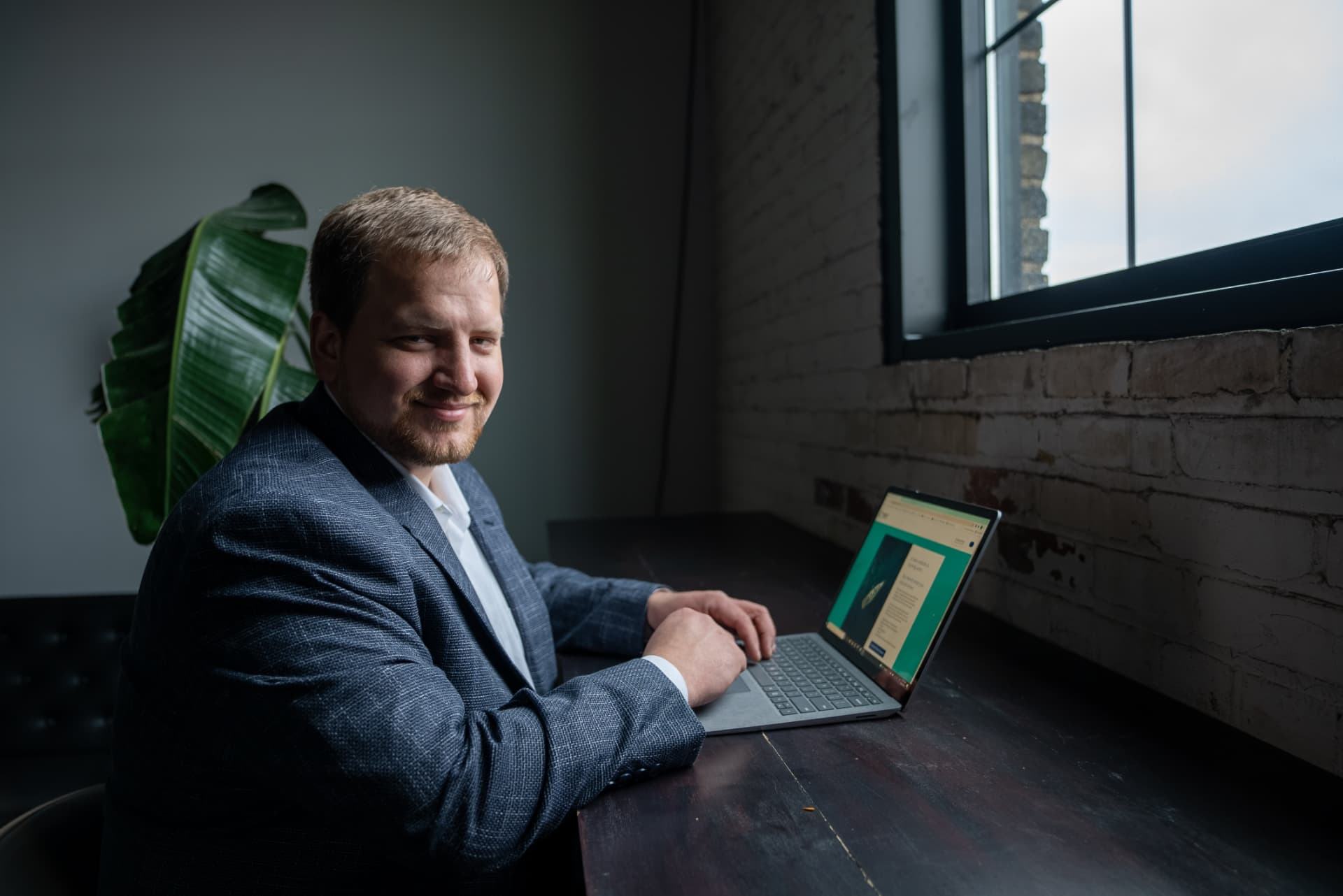 Trevor Haug, CPA, working at his laptop